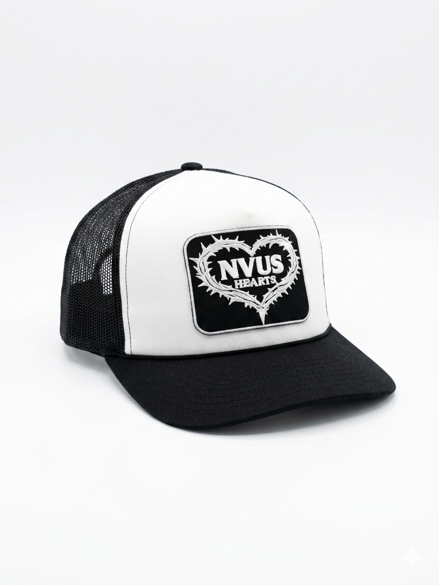 Black and white cap with 'NVUS HEARTS' logo on a light gray background
